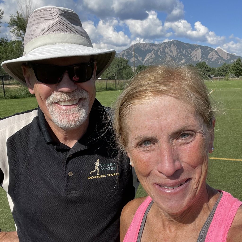 Sue Reynolds with running coach Bobby McGee
